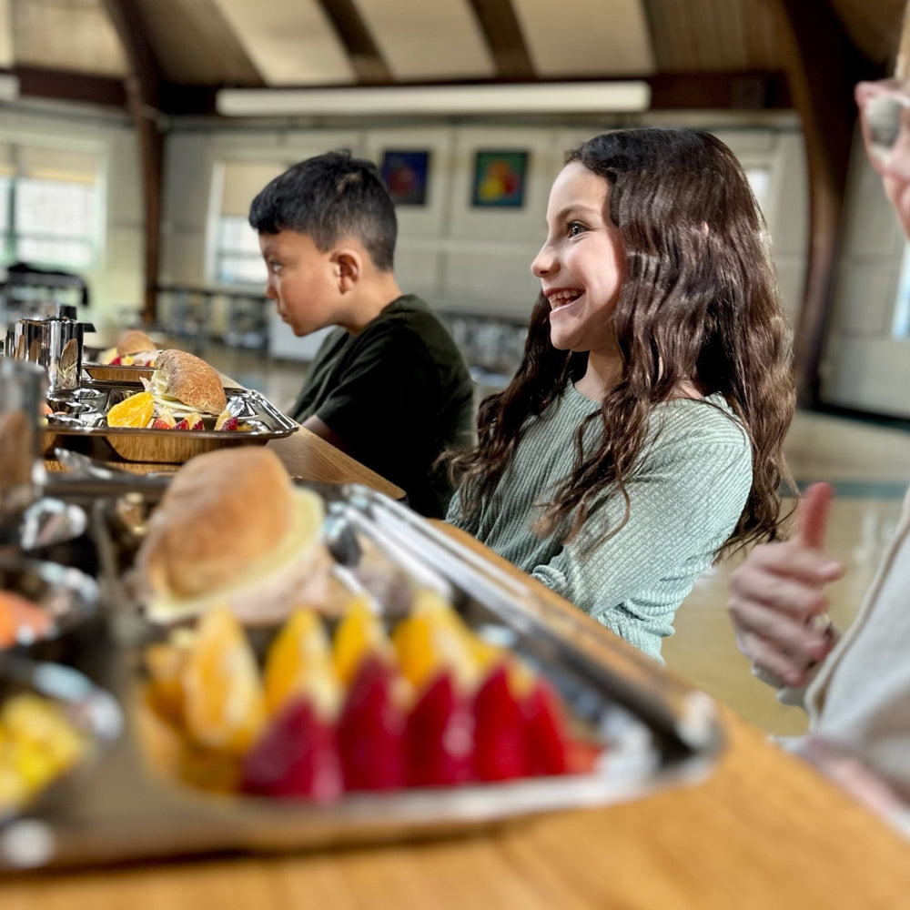 Children learning balanced nutrition with pediatrician-designed stainless steel trays